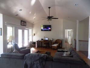 Large living area directly attached to the kitchen and dining area.