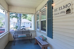 Enjoy the scenery and a gorgeous view of Lookout Mountain on the screened-in front porch.