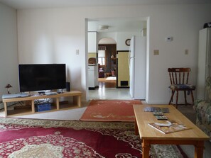 View of kitchen and living room from family Room couch