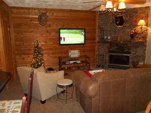 Cozy great room with a fireplace and unlimited firewood supply