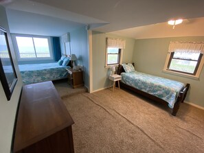 Master bedroom features 1 queen and 2 twin beds