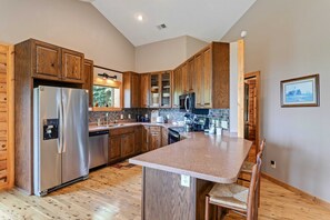 Modern Kitchen with Stainless Appliances and Bar Seating