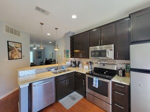 Kitchen has everything needed for cooking and dining