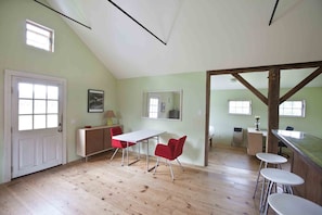 Dining area with wide board flooring