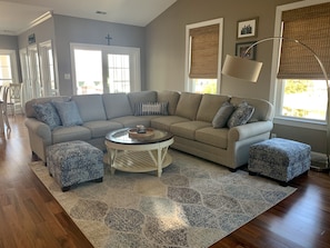 Family room with custom sectional and ottomans.  New in 2021.