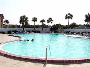 Relax at this beautiful pool area on the welcoming lounge chairs. 