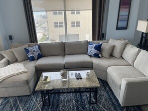 Living room has plenty of comfortable seating.