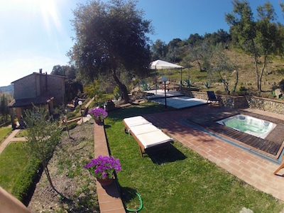 Luxurious villa in the tuscan countryside with views over Brunello vineyards.
