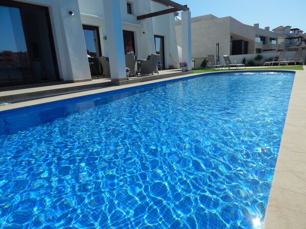 12 metre pool,patio areas and garden