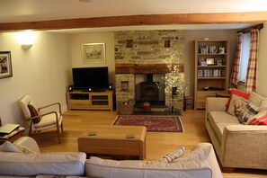 Lounge with fireplace and large screen TV