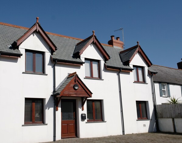Front of the cottage with two parking spaces