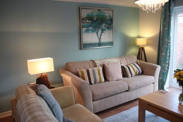 Cosy lounge area with three sofas 