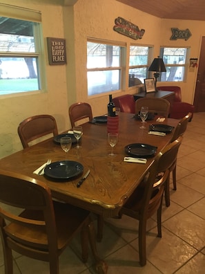 Large dinner table offers views of the river and close to kitchen.