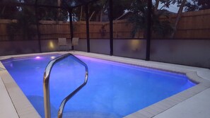 Beautiful heated and colored 28 foot pool with a new cage