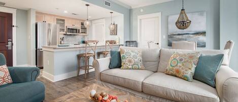 Living room - This charming living room is multi-functional. The couch transforms into a queen sleeper!
