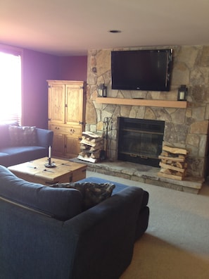 Living room with fireplace and big screen TV!