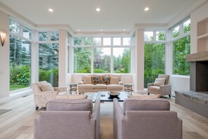 Living room with Baldy view, wood burning fireplace, open to dining and kitchen.