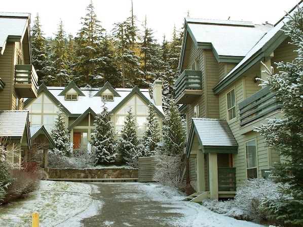 Snowgoose is nestled in the trees at the foot of Blackcomb Mountain. 