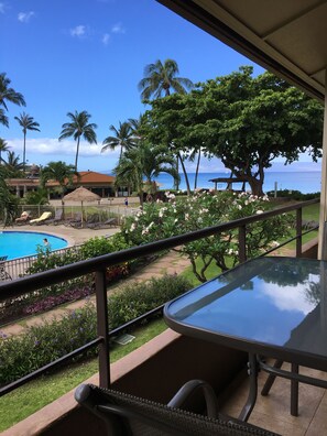 the Lanai overlooks ocean, swimming pool and the green west Maui mountains
