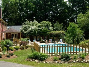 A gazebo, large grill and pool make for a great family picnic. 