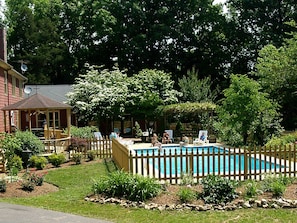 A gazebo, large grill and pool make for a great family picnic.