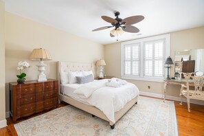 Spacious master bedroom with walk-in closet and chic new rug. 