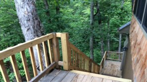 stairs to loft nestled in the canopy.  