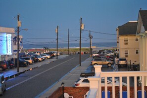 Deck area view of the beach and ocean.