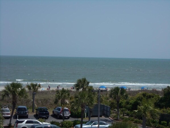 OUR VIEW -3rd floor,sunny south side.  Hear/see ocean from inside villa as well