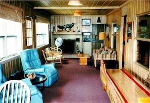 Enclosed porch with fireplace in house