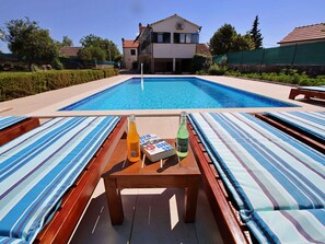 Sky, Water, Table, Daytime, Property, Plant, Furniture, Swimming Pool, Window, Building