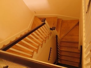 Apartment entry from the second floor door up to the third floor living area.