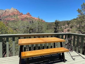 Back deck picnic table for our guests to enjoy dining with views!