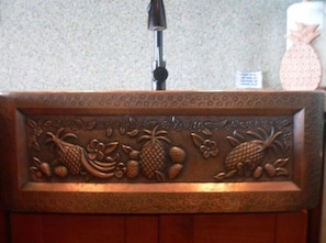 CUSTOM-MADE COPPER SINKS IN KITCHEN AND BATHROOM