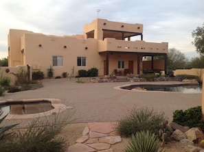 Courtyard view of Casita which is attached to 2 car garage.