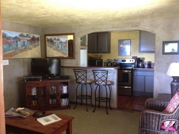 Living room into kitchen of apt.