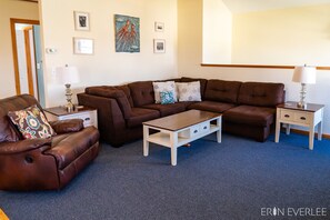 top floor open-concept living room with recliner