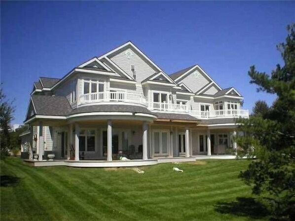 Lake Charlevoix view. Building is 4 units. 2 up and 2 down. Ours is the top left