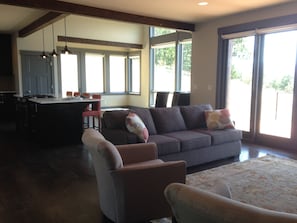 Looking into living room, dining room and kitchen.