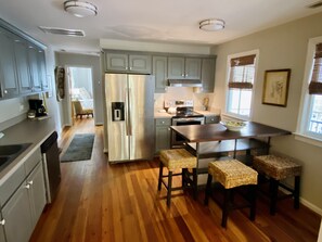 Kitchen updated with stainless appliances and dining island 