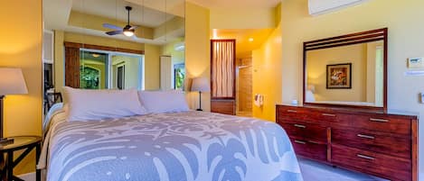 the main bedroom features a Cal-king bed, A/C and an attached private bathroom
