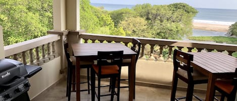 Patio with high top tables, grill and great views