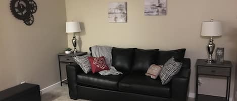 Living room w TV & pull out queen size sofa bed w/pillow top mem foam mattress