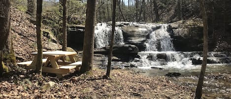 Three Picnic tables are set on the property 