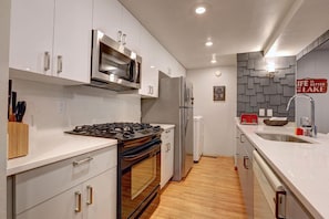 All new kitchen counters, cabinets, utensils, pots/pans, dishes, fridge.