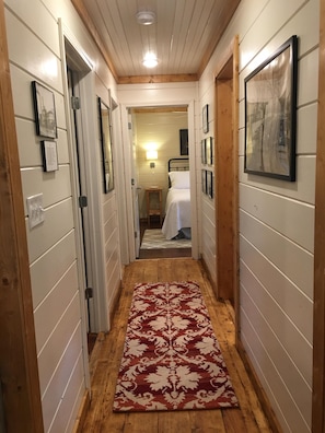 Hallway. laundry on the right, bathroom on left, bedrooms are at the end.