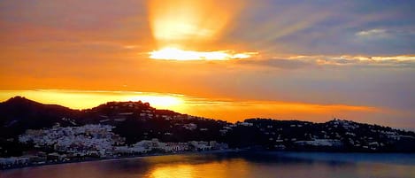 Sunrise over La Herradura Bay from top terrace