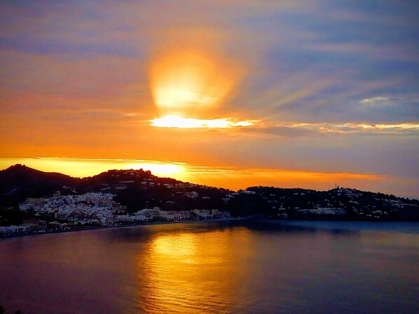 Sunrise over La Herradura Bay from top terrace