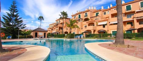 exterior - apartment overlooking main pool area and golf course beyond