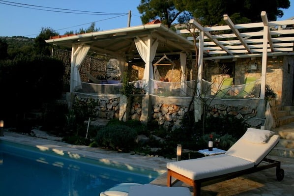 private patio for total relaxation, with swimming pool, gazebo & summer kitchen